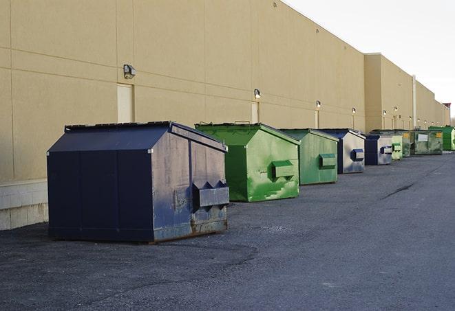 a construction dumpster filled with debris in Dunnigan